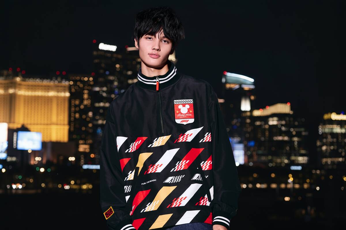 A model shows off some Disney-F1 gear as part of the companies' "Fuel The Magic" campaign debut ...