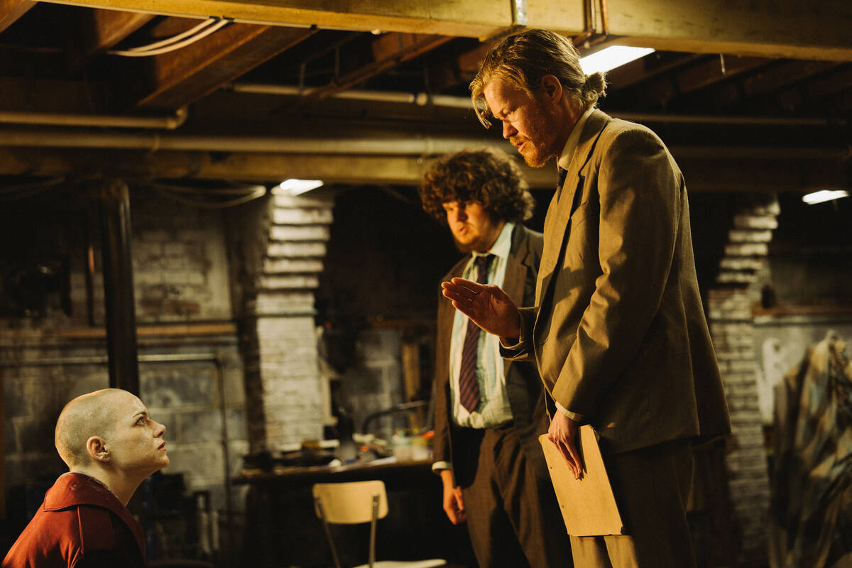 This image released by Focus Features shows Emma Stone, from left, Aidan Delbis, and Jesse Plem ...