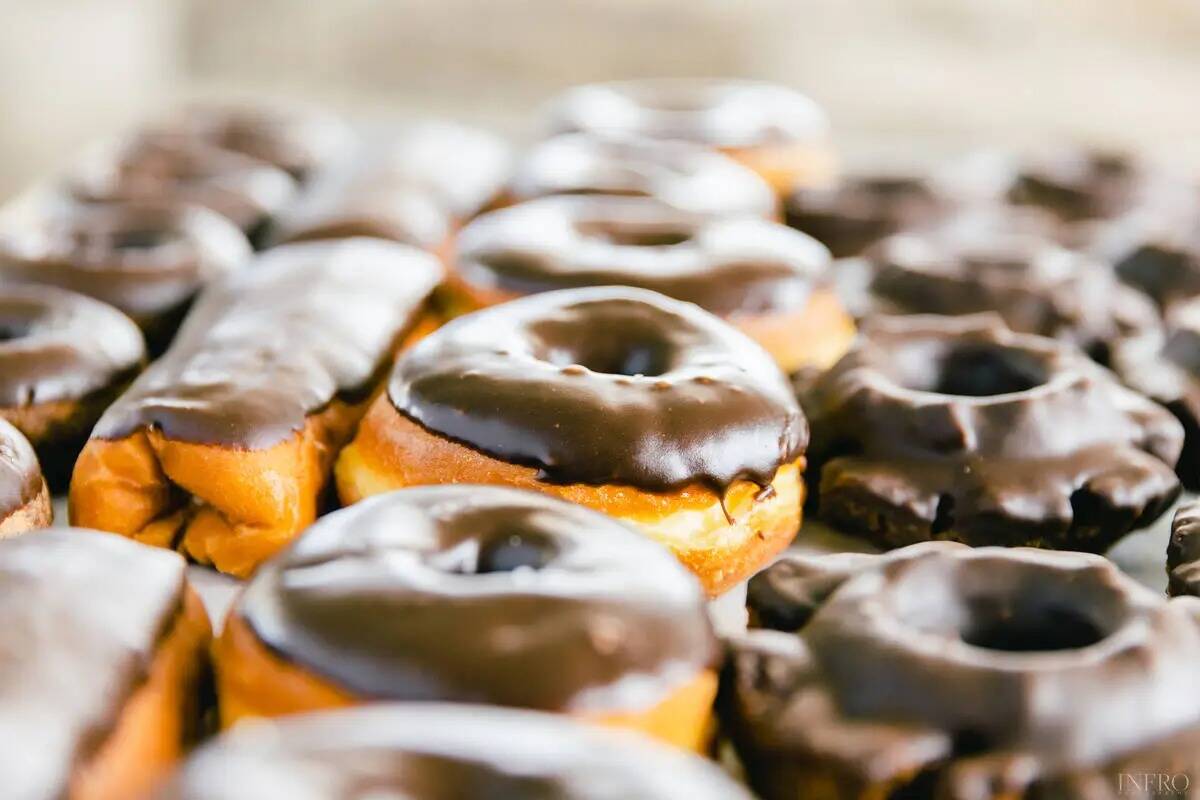 A spread of chocolate glazed doughnuts from Randy's Donuts, the shop famous for the giant dough ...