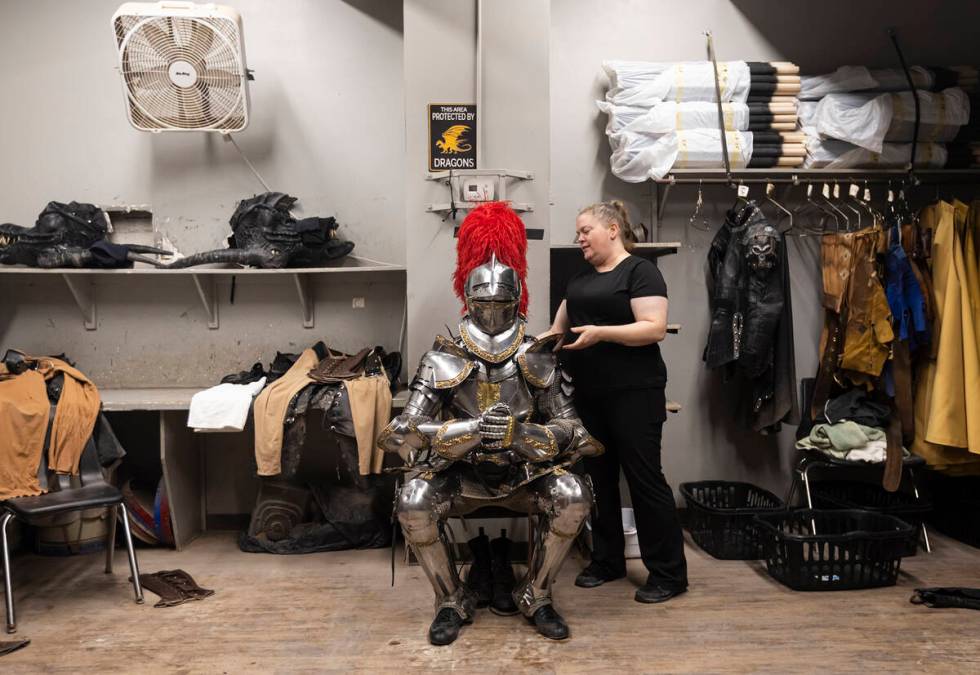 Shannon Lusk tends to a well-amored knight before a performance. (Chase Stevens/Las Vegas Revie ...