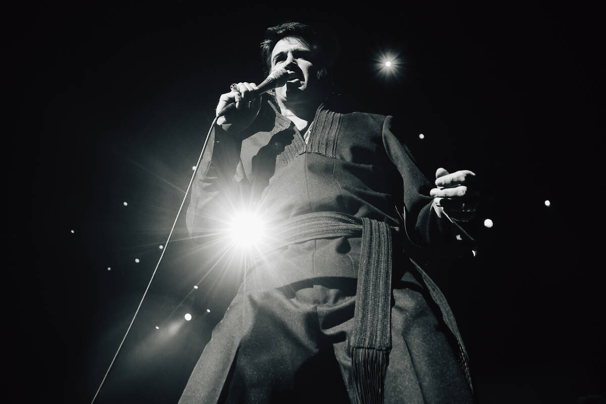 Travis Powell, an Elvis tribute artist, performs during “1969 Live Concert: The King Ret ...