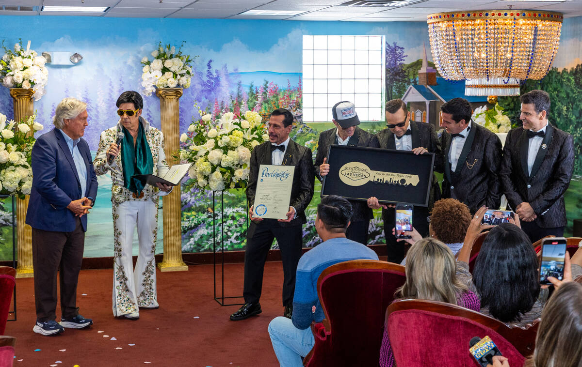 Clark County Commissioner Tick Segerblom talks with Ron DeCar as Elvis as he presents a procla ...