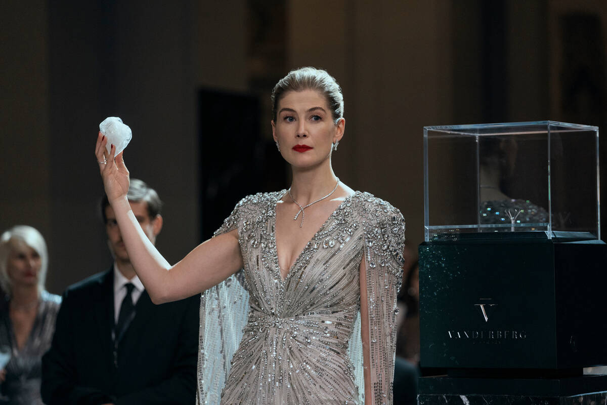 This image released by Lionsgate shows Rosamund Pike in a scene from "Now You See Me: Now ...