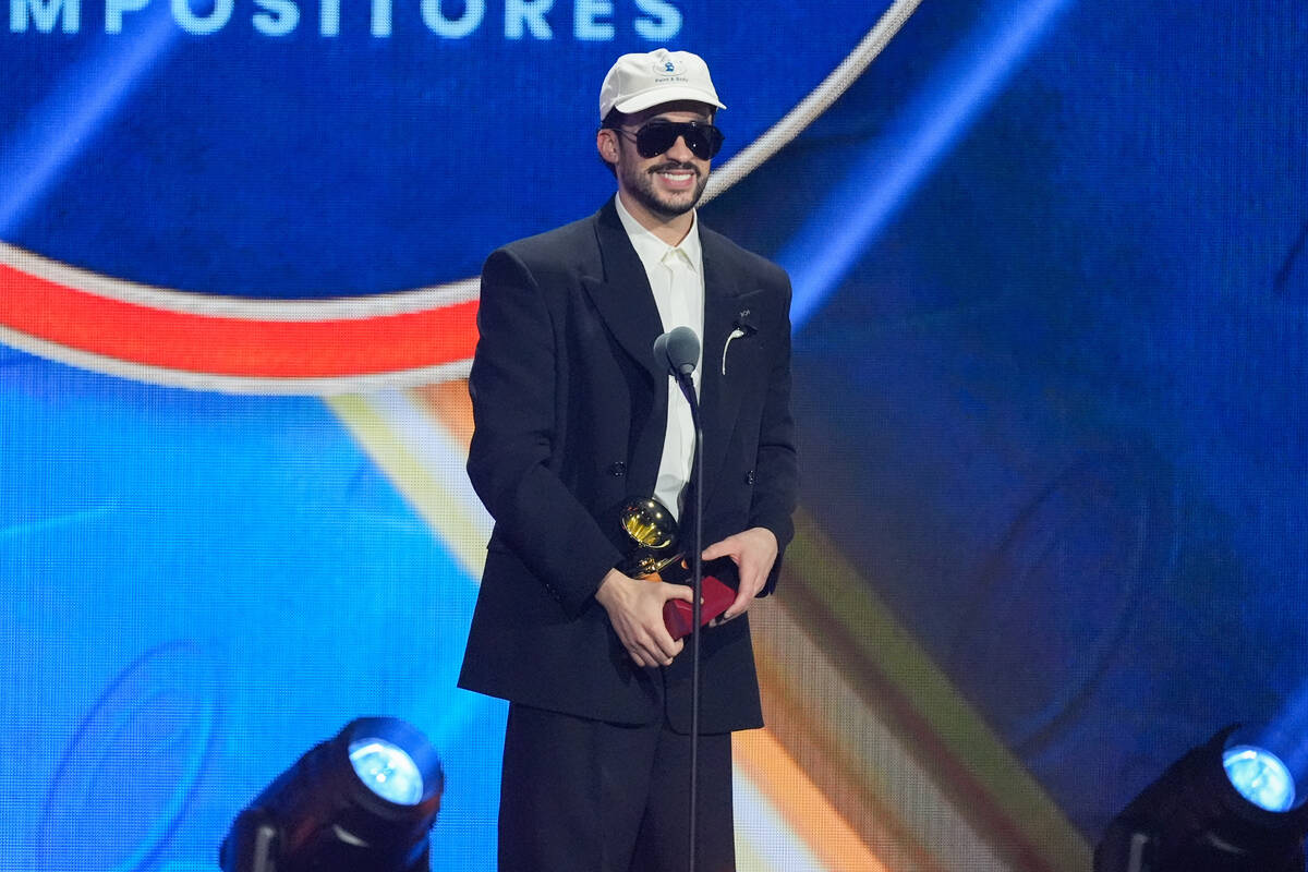 Bad Bunny accept the award for best urban song for "DtMF," during the 2025 Latin Gram ...
