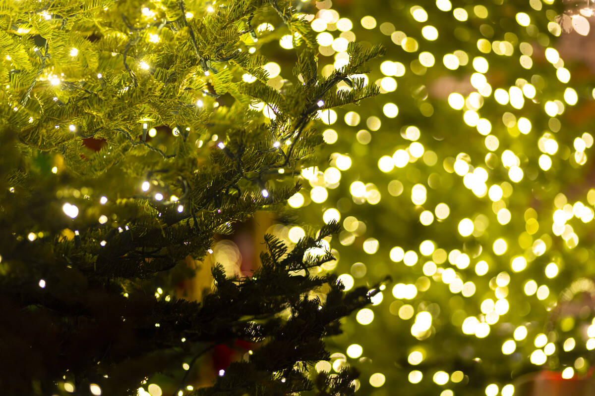 Christmas lights and ornaments are seen on a tree at the holiday display at the Bellagio Conser ...