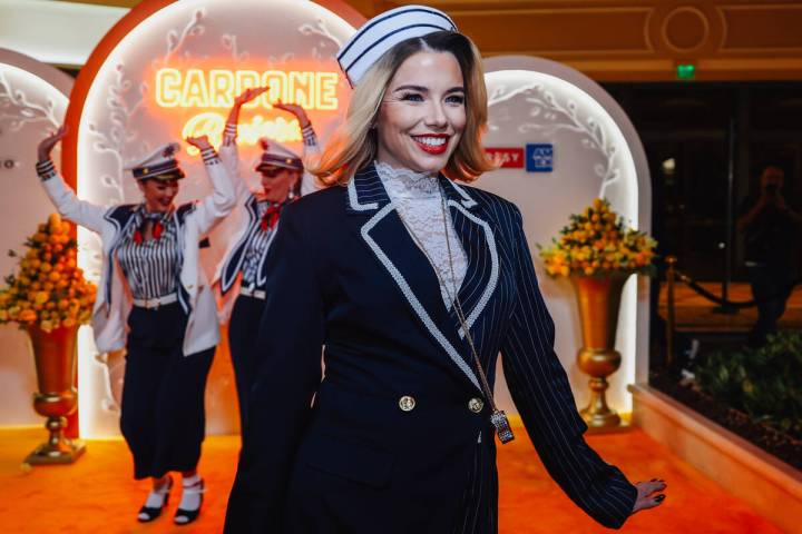 Models welcome patrons during the grand opening of Carbone Riviera at the Bellagio Thursday, No ...