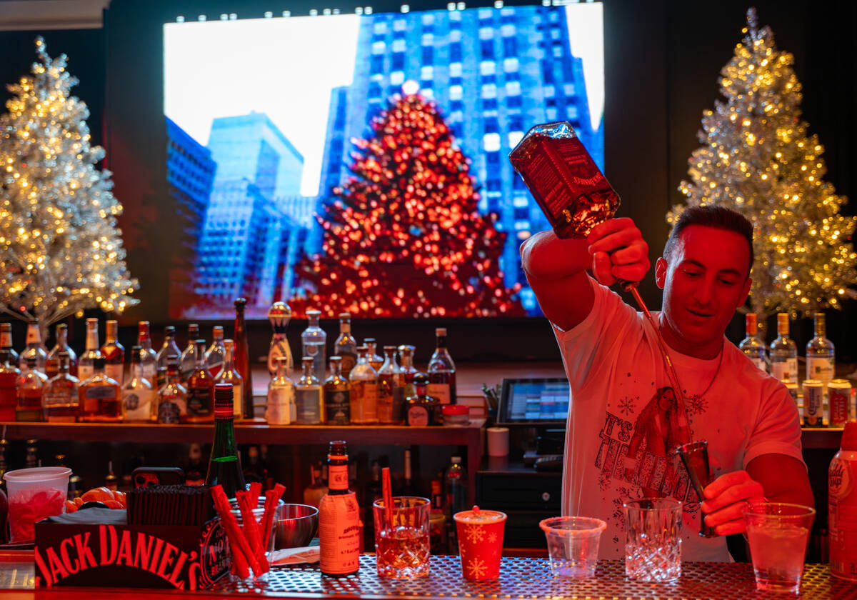 Bartender Peter Picciano II makes a signature drink at The Mariah Carey Holiday Bar pop-up insi ...