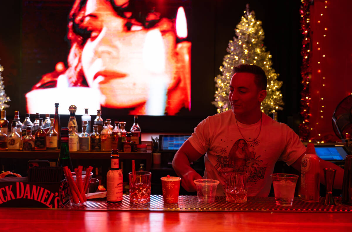 Bartender Peter Picciano II makes a signature drink at The Mariah Carey Holiday Bar pop-up insi ...