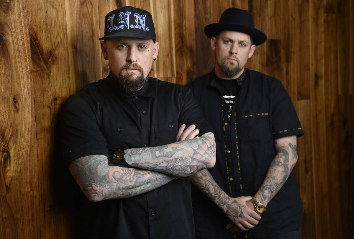 Benji Madden, left, and his twin brother Joel Madden of the rock band Good Charlotte pose for a ...