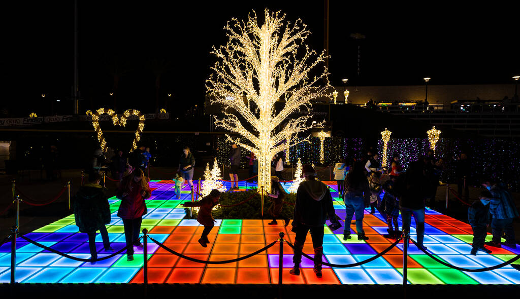 Attendees explore Enchant Christmas at Las Vegas Ballpark on Tuesday, Nov. 30, 2021, in Las Veg ...