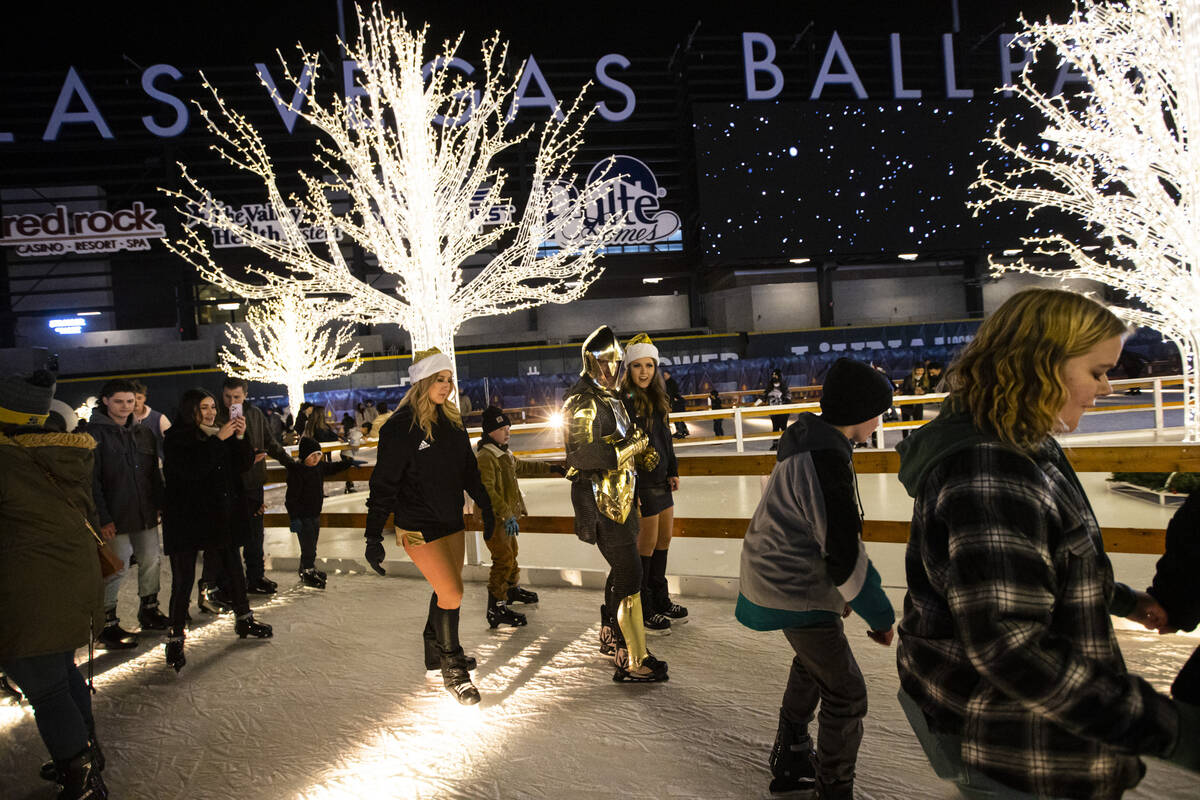 Lee Orchard, the Golden Knight, skates with attendees and members of the Knights Guard during t ...