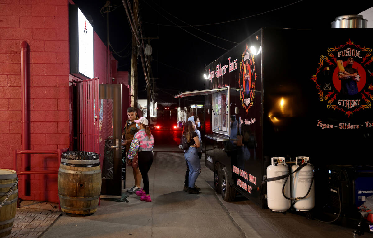 People arrive on reopening night at Cork and Thorn in downtown Las Vegas Sunday, March 21, 2021 ...