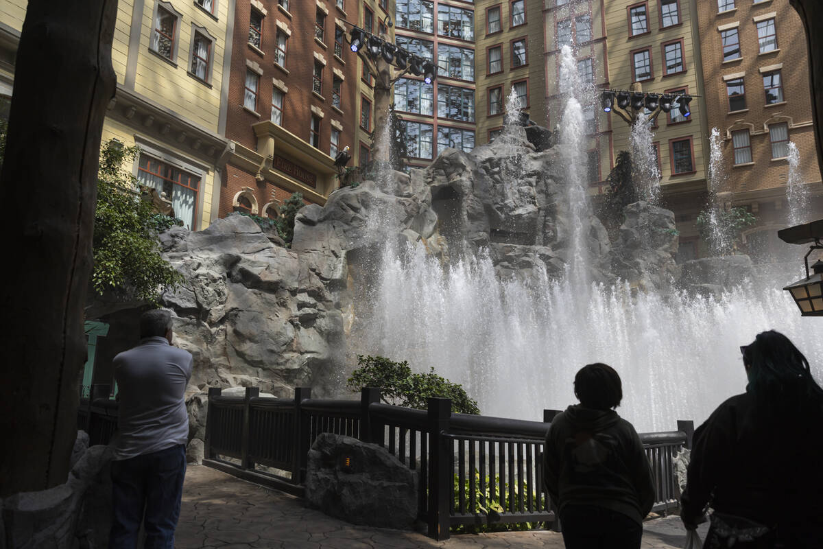 People watch the laser and water show at Mystic Falls Park at Sam’s Town on Tuesday, Jun ...