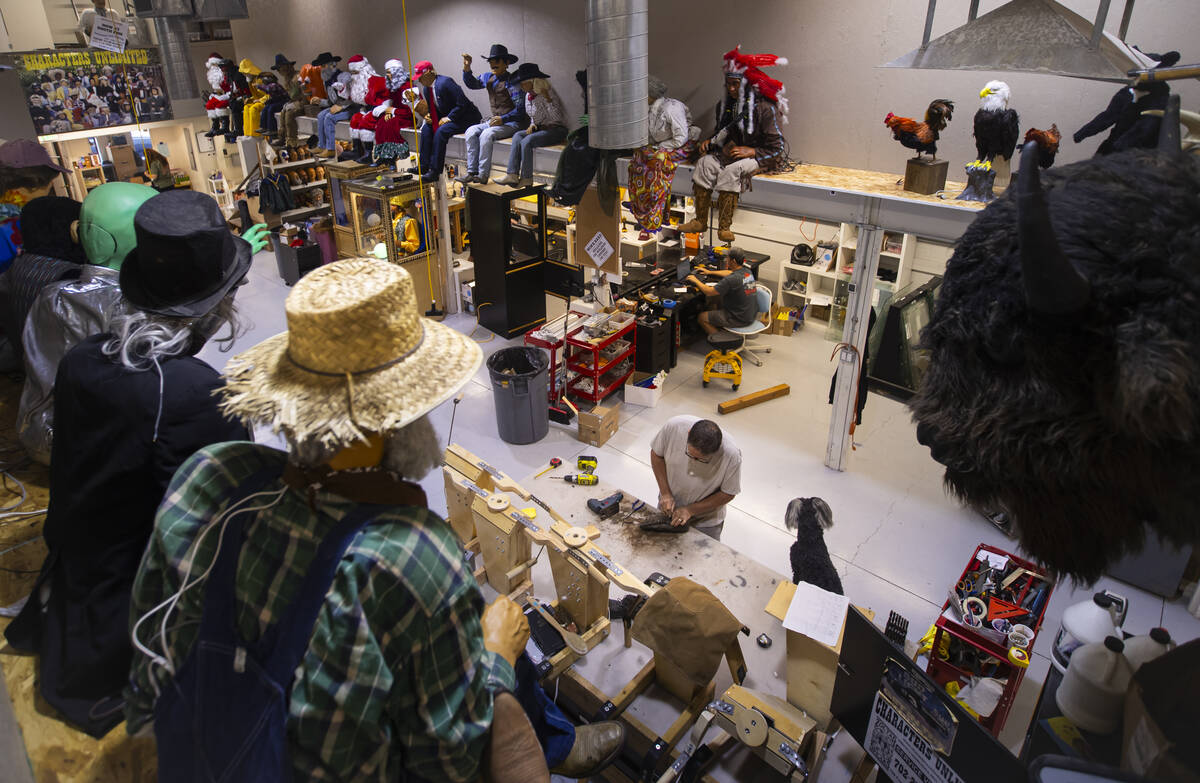 Employees are seen working on projects during a tour of Characters Unlimited, which produces li ...