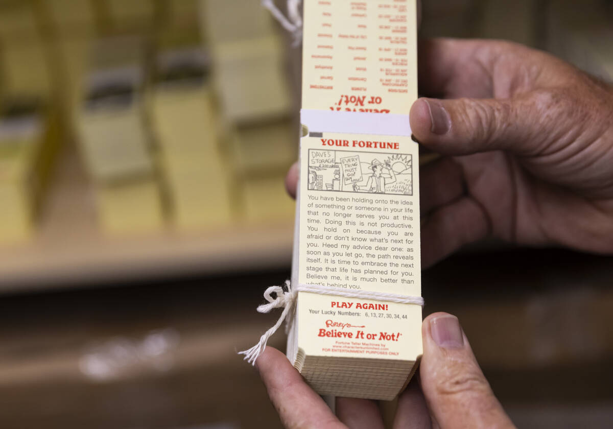 Fortune cards created for Ripley's Believe It or Not! are shown by Olaf Stanton, president and ...