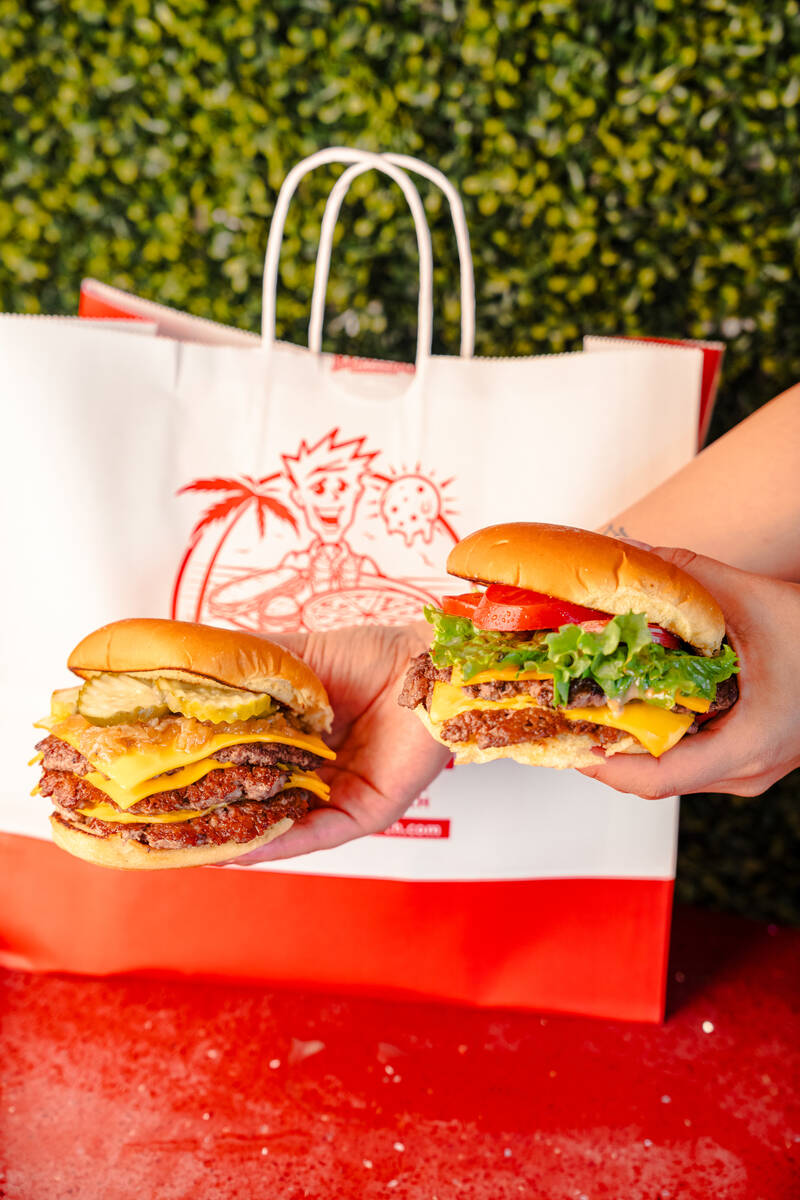 A Redhead Cheeseburger, left, and a Double Cheeseburger from Redhead Burger of Miami Beach, Flo ...