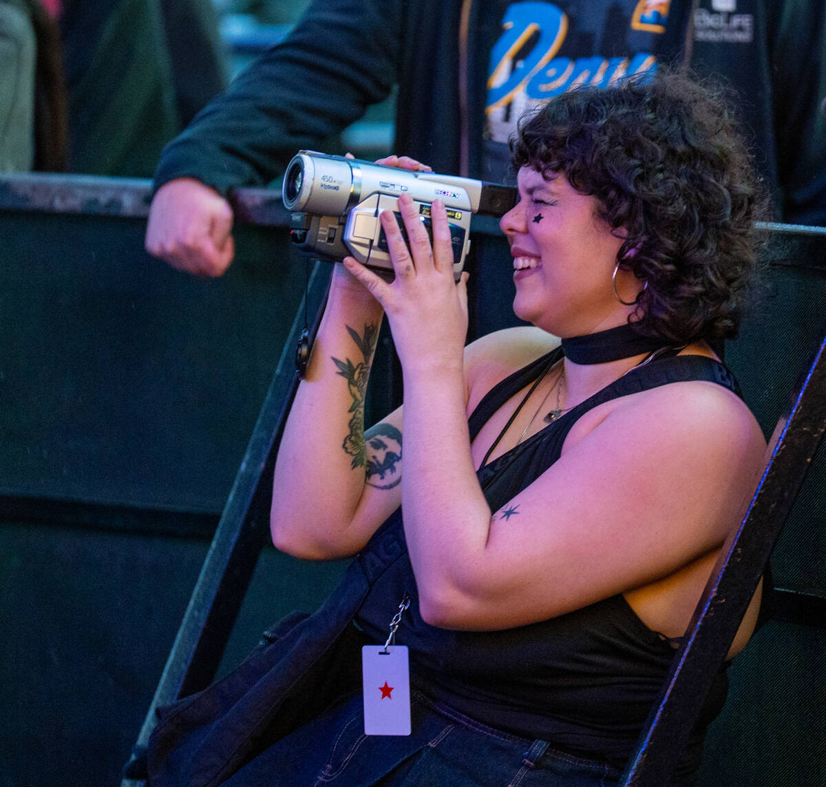 A fan records with a video camera as Pure Sport preforms on the First Street stage during the N ...