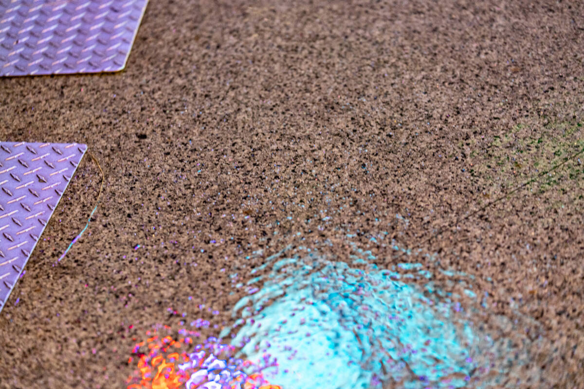 A light ran falls as Pure Sport preforms on the First Street stage during the Neon City Music F ...