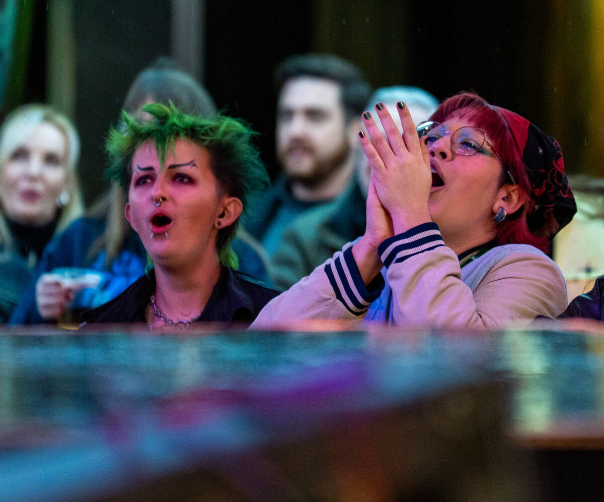 Fans cheer as Pure Sport preforms on the First Street stage during the Neon City Music Festival ...