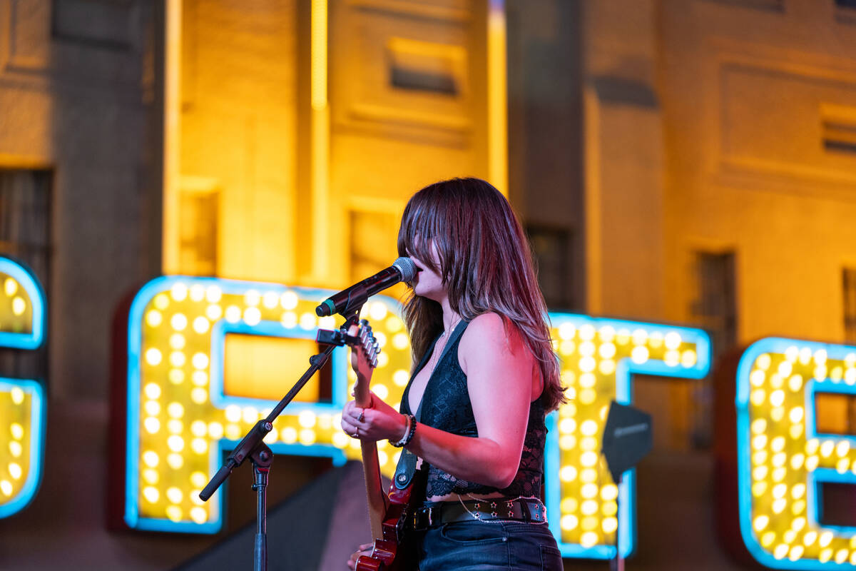 Angela Avery, lead vocalist and guitarist for The Dollheads, performs on the Main Street stage ...