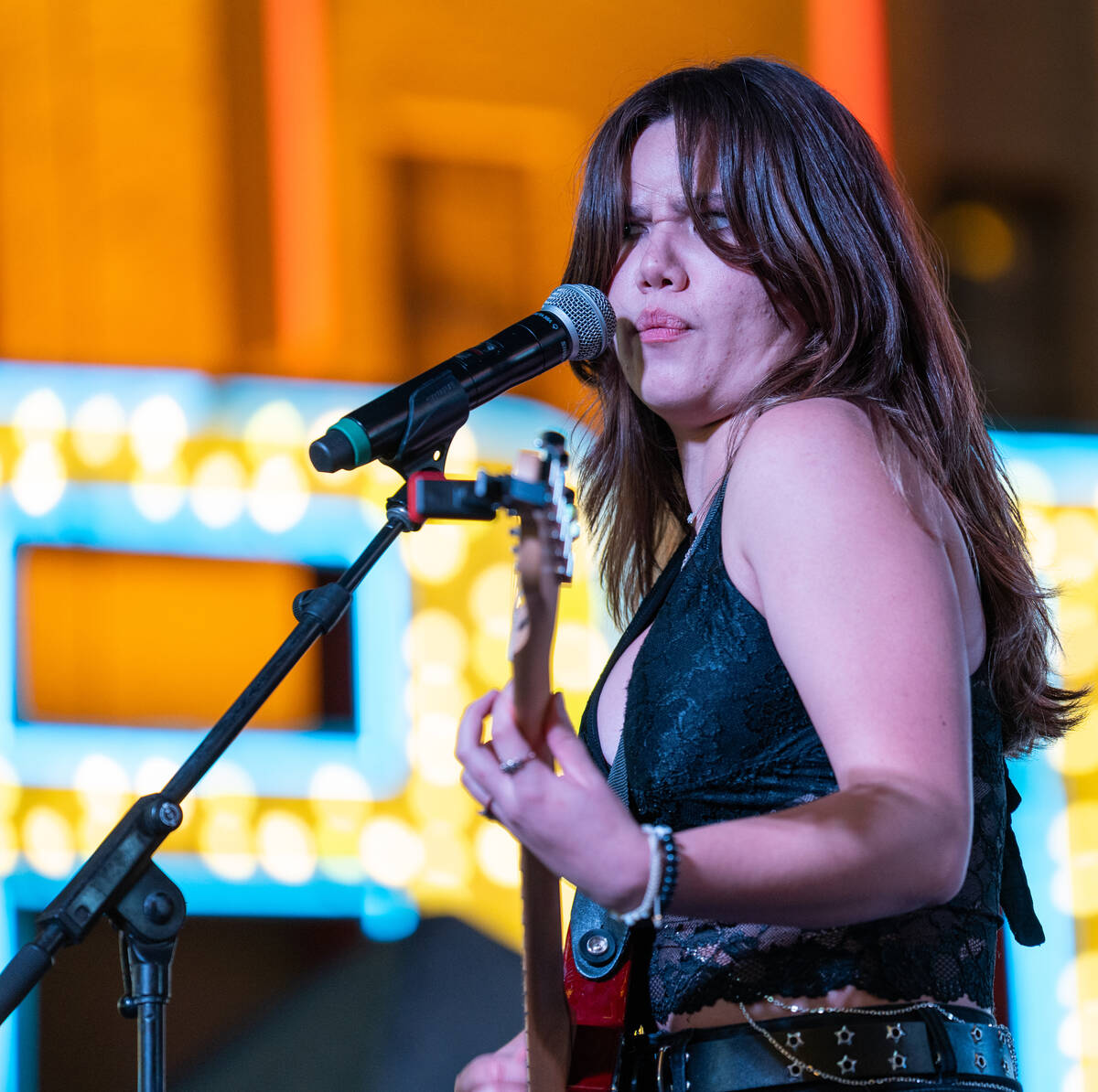 Angela Avery, lead vocalist and guitarist for The Dollheads, performs on the Main Street stage ...