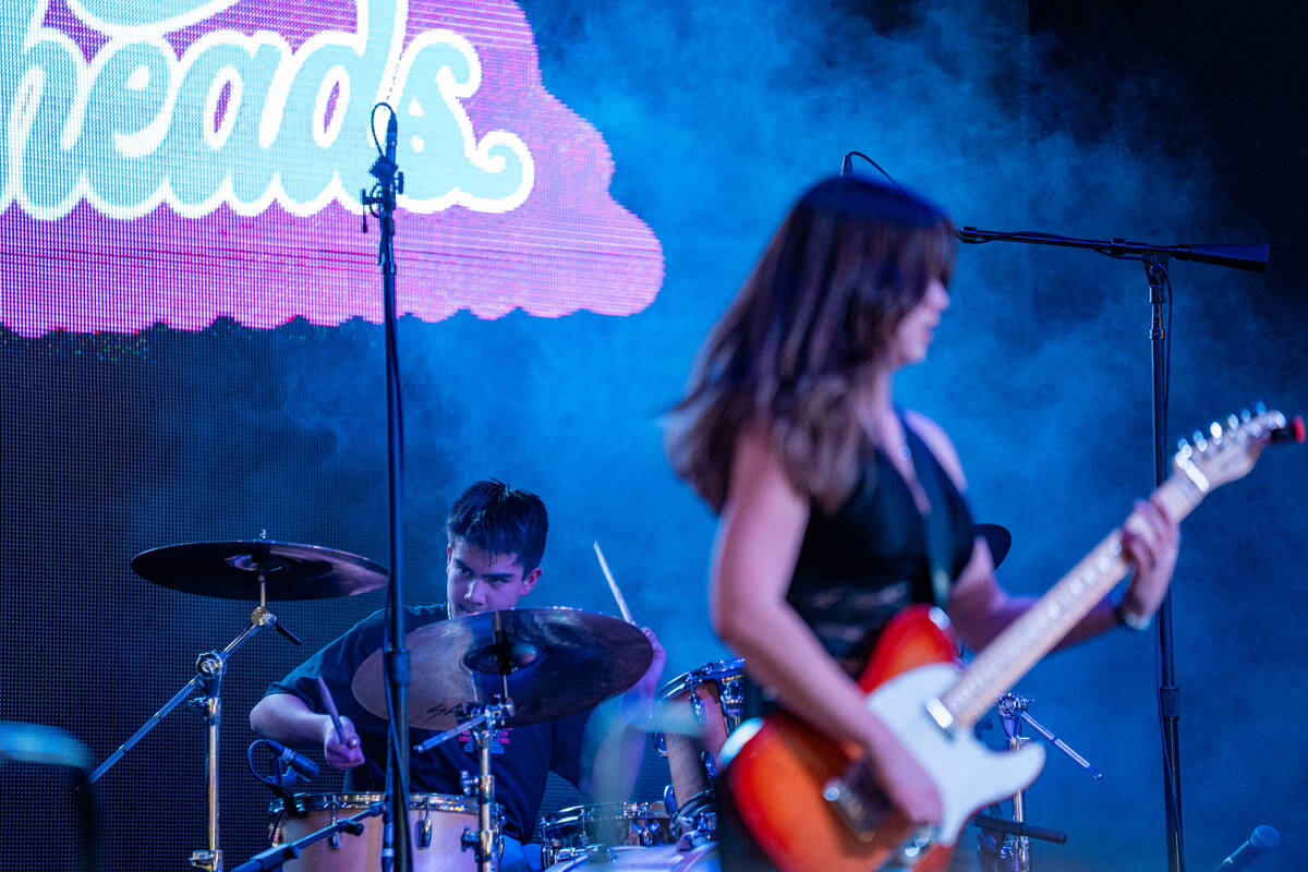 Angela Avery, lead vocalist and guitarist for The Dollheads, performs with brother Austin Avery ...