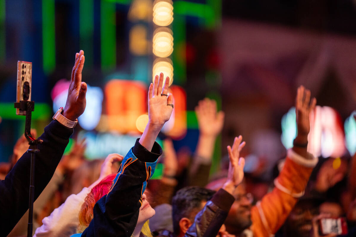 Kelvin Mercer of De La Soul tells the crowd to wave their hands during their performance on the ...