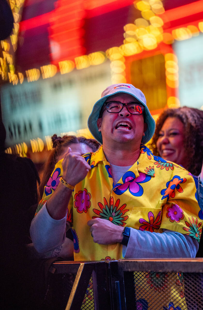 A fan cheers as De La Soul preforms on the Third Street stage during the Neon City Music Festiv ...