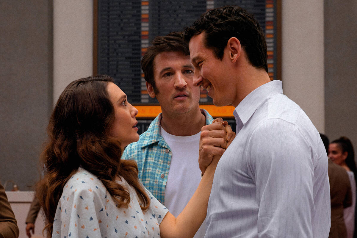 Elizabeth Olsen, Miles Teller and Callum Turner in a scene from "Eternity." (Leah Gal ...