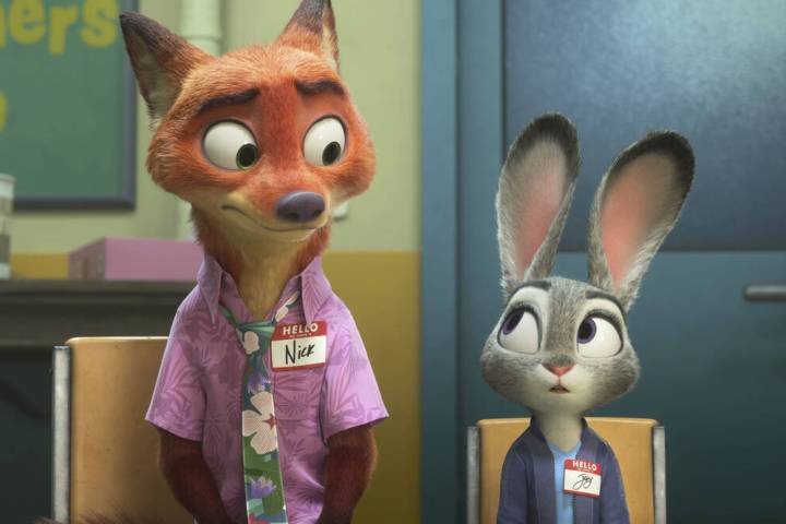 This image released by Disney shows Nick Wilde, voiced by Jason Bateman, left, and Judy Hopps, ...