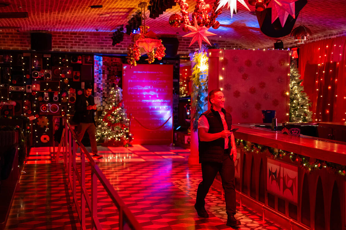 Bartender Peter Picciano II heads to prepare the ball for a private party inside The Mariah Car ...