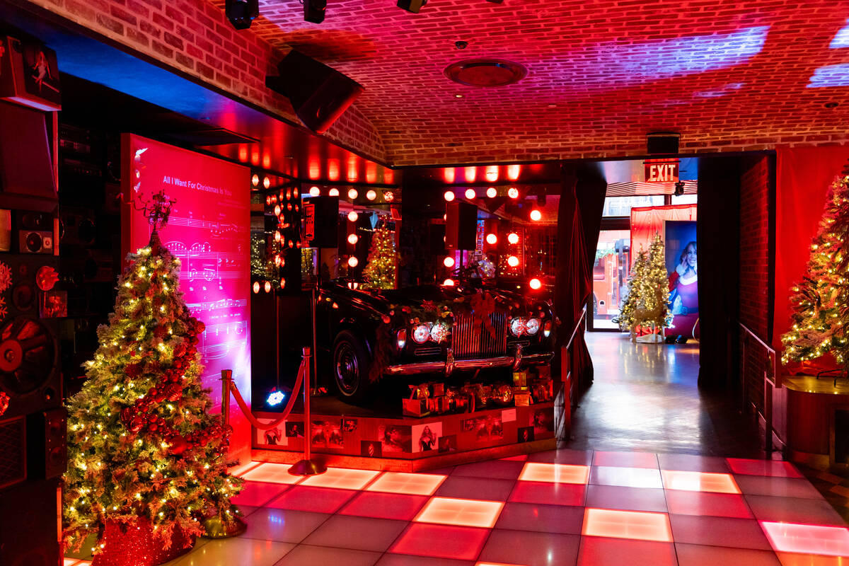 The dj table is decorated for The Mariah Carey Holiday Bar pop-up at On the Record at Park MGM ...