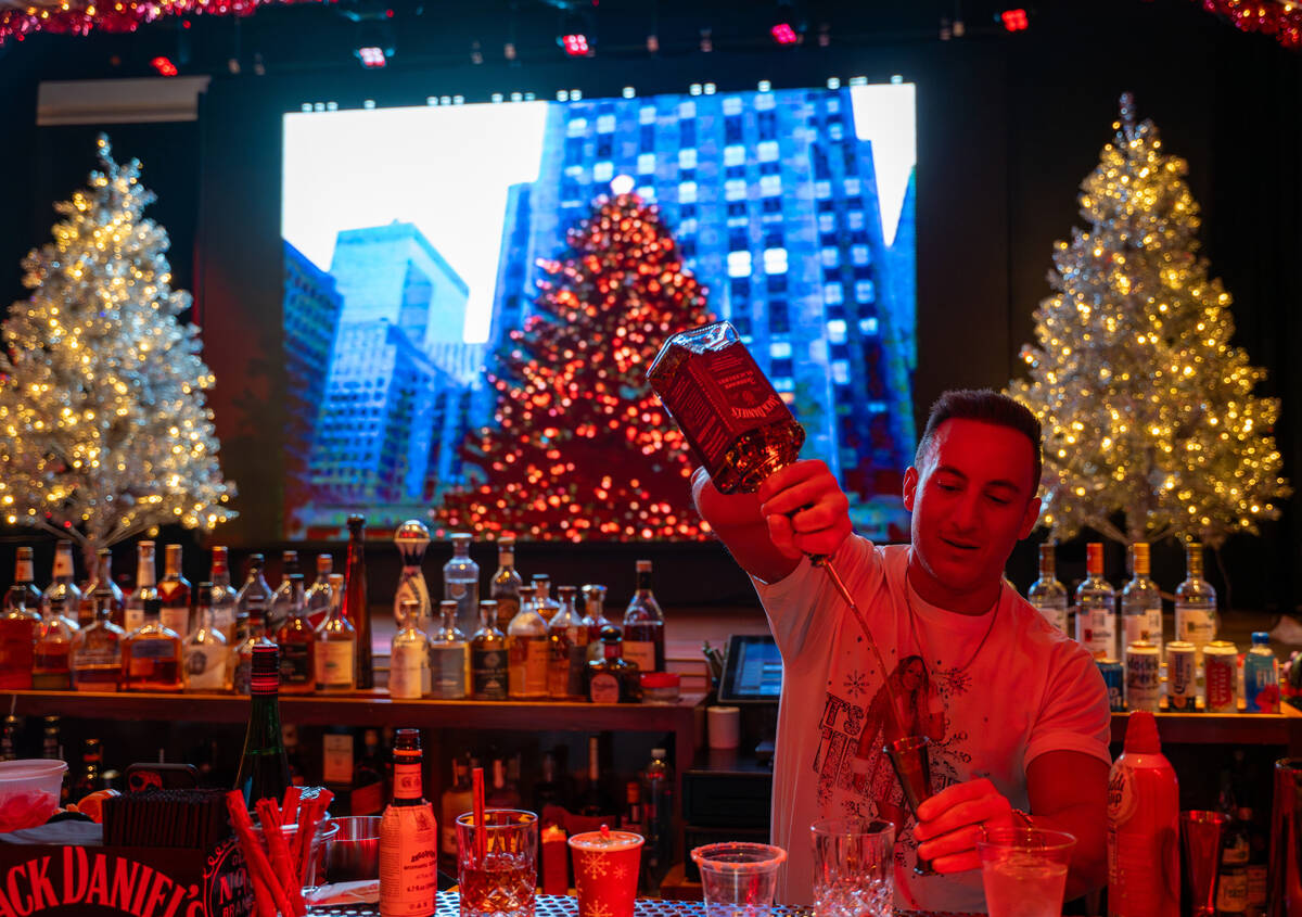 Bartender Peter Picciano II makes a signature drink at The Mariah Carey Holiday Bar pop-up insi ...