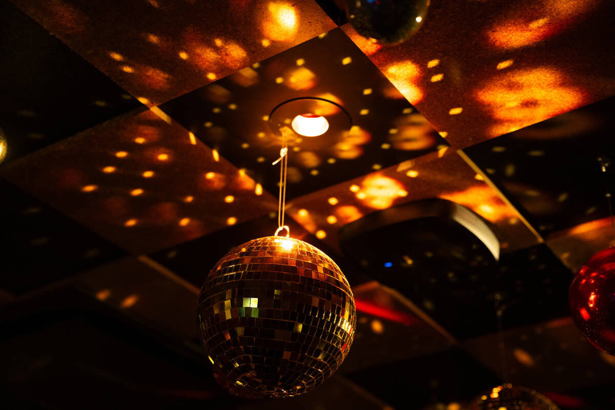 A disco ball hangs inside one of the karaoke rooms at The Mariah Carey Holiday Bar pop-up at On ...