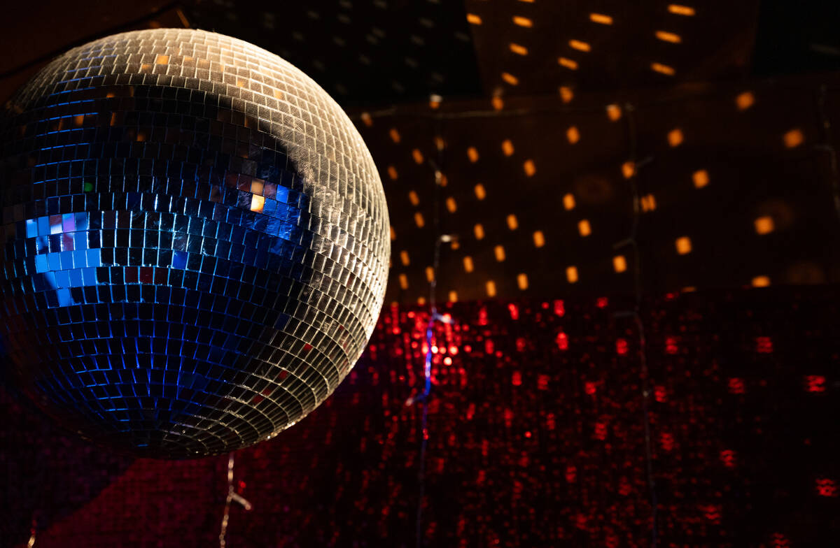 A disco ball hangs inside one of the karaoke rooms at The Mariah Carey Holiday Bar pop-up at On ...