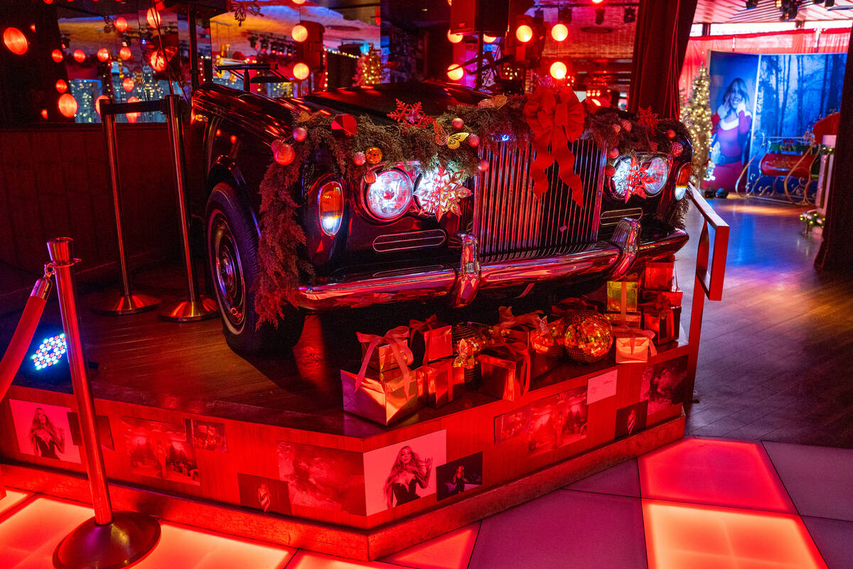 The dj table is decorated for The Mariah Carey Holiday Bar pop-up at On the Record at Park MGM ...