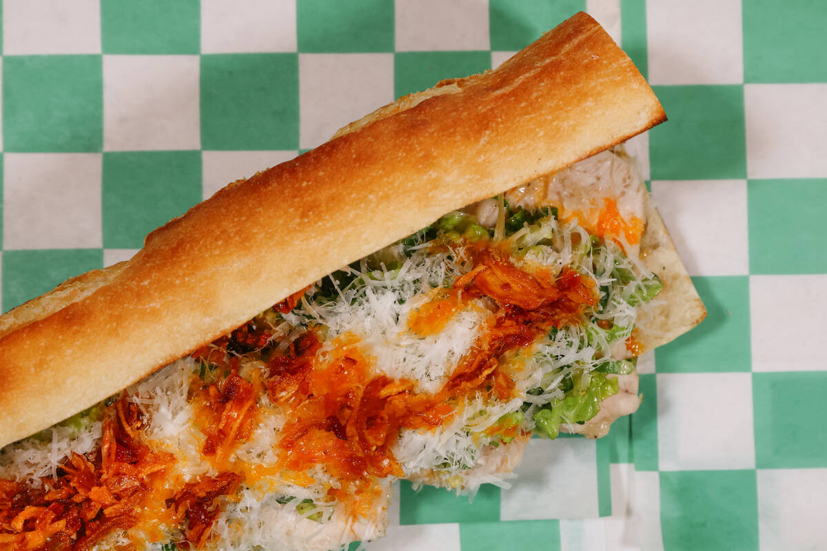 The chicken sandwich, with Caesar dressing, chili crisp, shredded lettuce, bread crumbs and Par ...