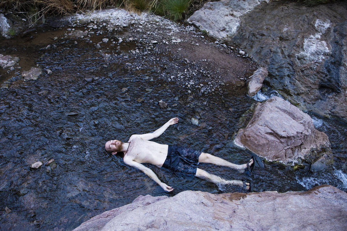 Andy Udelsman of Las Vegas lies in the warm waters from the Gold Strike Hot Springs along the C ...