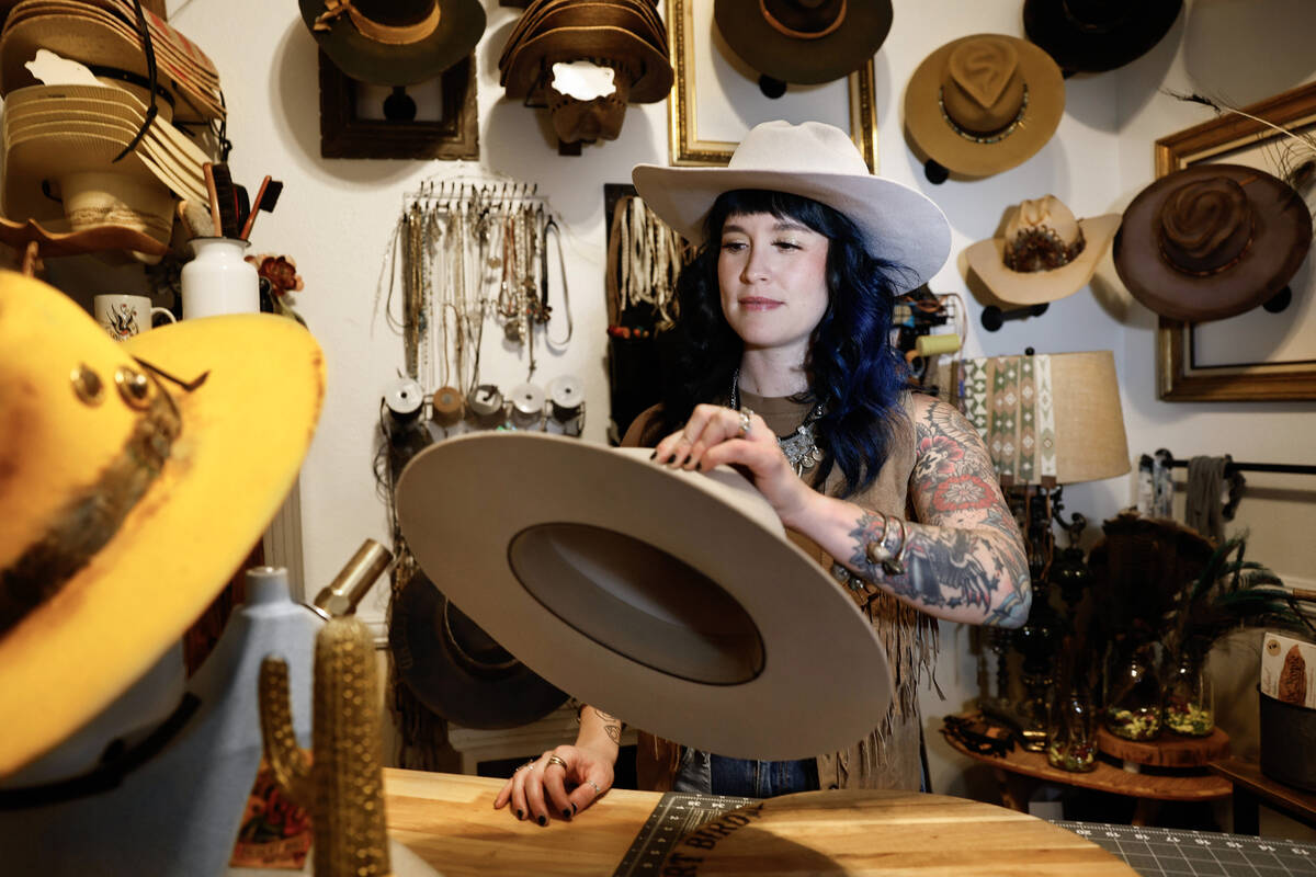Desert Bird Hat Co owner Kelly Sokoloski steams a custom made hat Friday, Sept. 26, 2025 in Las ...