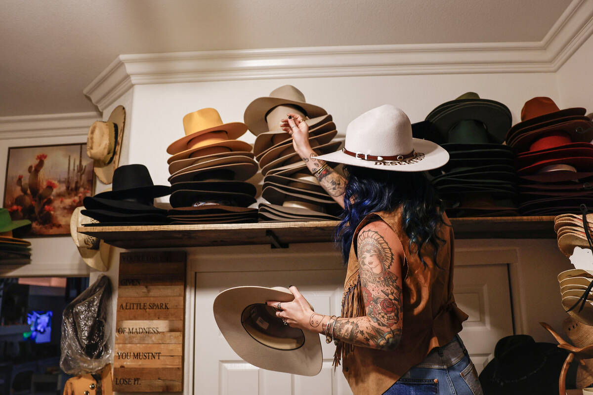 Desert Bird Hat Co owner Kelly Sokoloski organizes a group of her custom made hats Friday, Sept ...