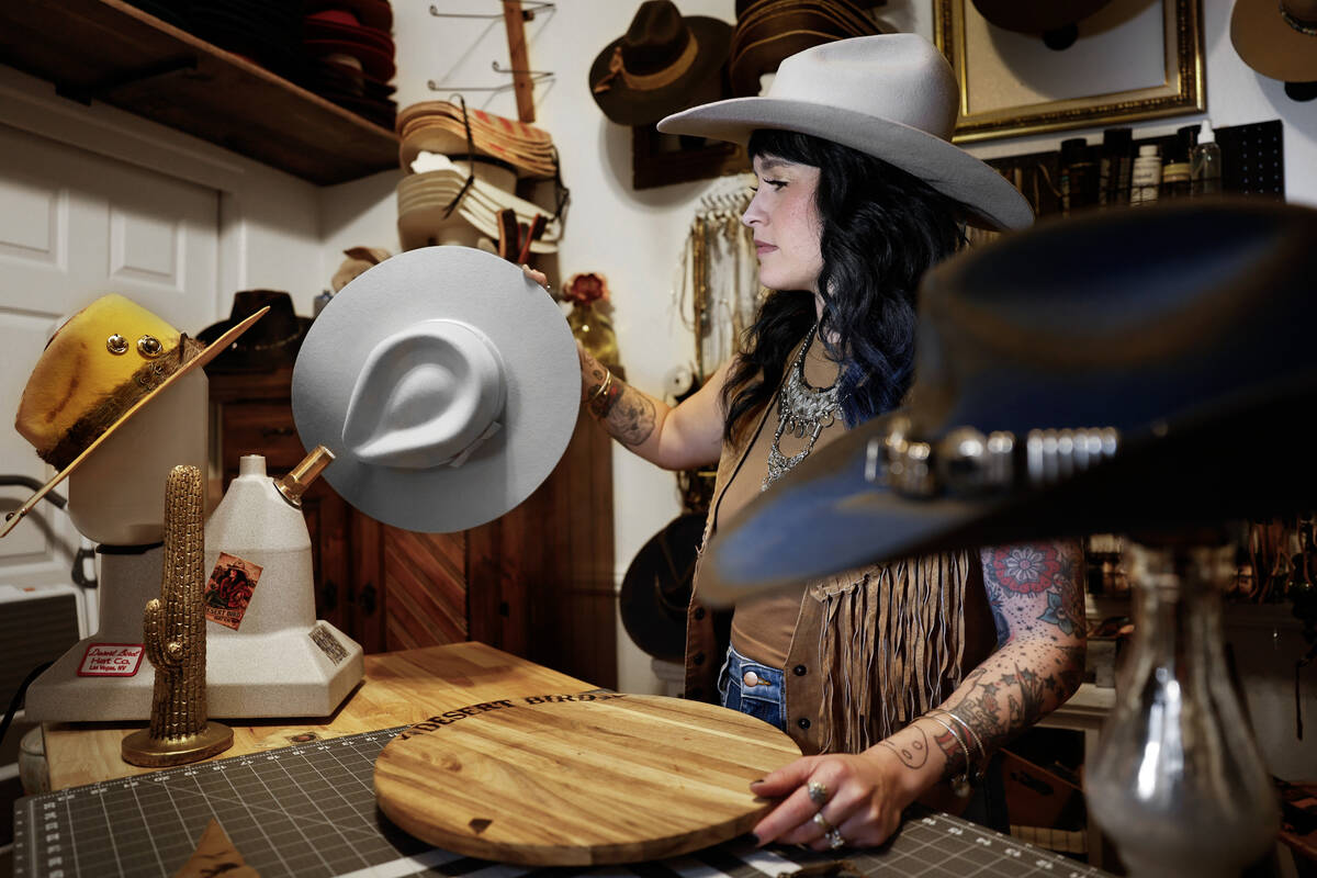 Desert Bird Hat Co owner Kelly Sokoloski steams a custom made hat Friday, Sept. 26, 2025 in Las ...