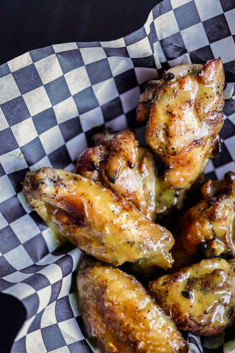 Mango habanero wings are seen at Guerrilla Pizza Wednesday, Dec. 3, 2025 in Las Vegas. (Benjami ...
