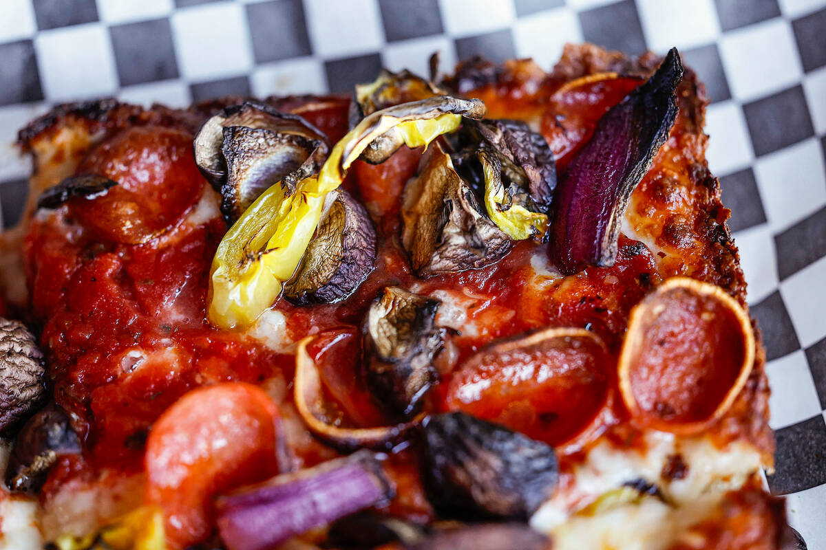 A build your own pizza with pepperoni, mushroom, red onion and banana peppers is seen at Guerri ...