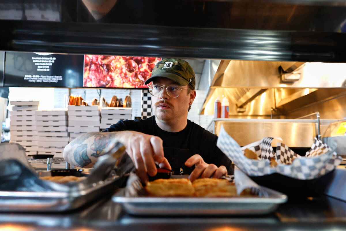 Chef-owner Robby Cunningham works in the kitchen at Guerrilla Pizza Wednesday, Dec. 3, 2025 in ...