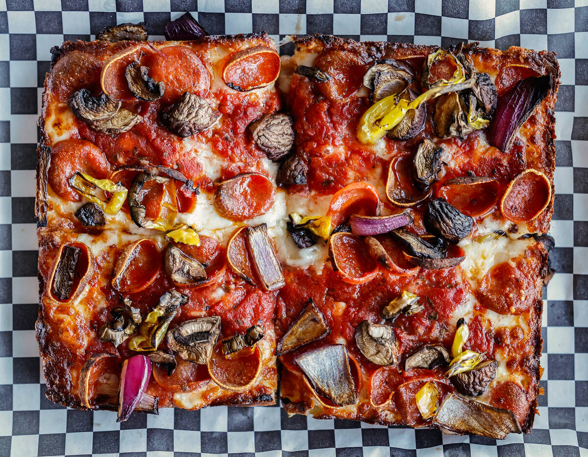 A build your own pizza with pepperoni, mushroom, red onion and banana peppers is seen at Guerri ...