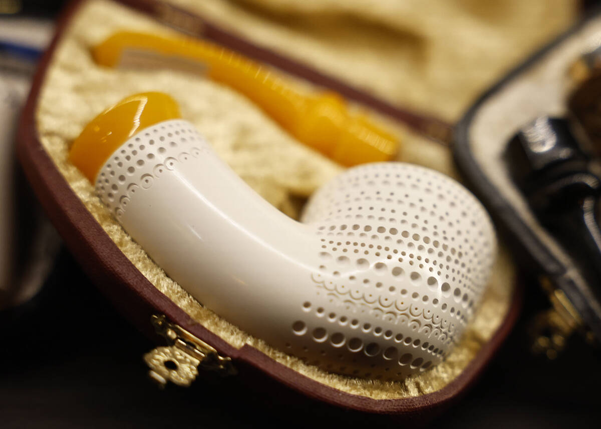 Exotic tobacco pipes are photographed in decorative cases at The Dark Arts room at Grey Witch T ...