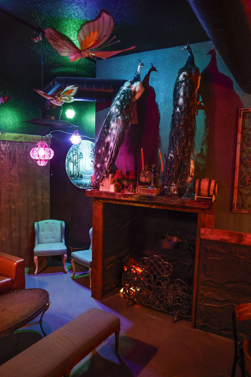 The lounge leading into The Dark Arts room through the fireplace at Grey Witch is photographed ...