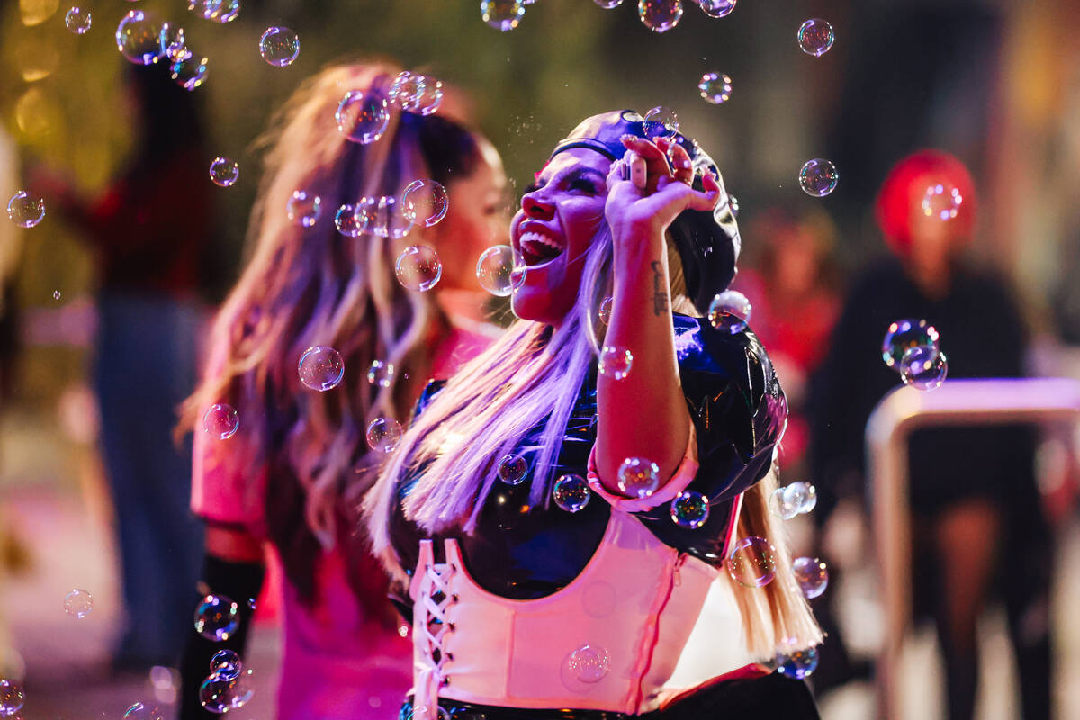 Josetty Hurtado reacts to bubbles during the grand opening of the Malibu Barbie Cafe at Area15 ...
