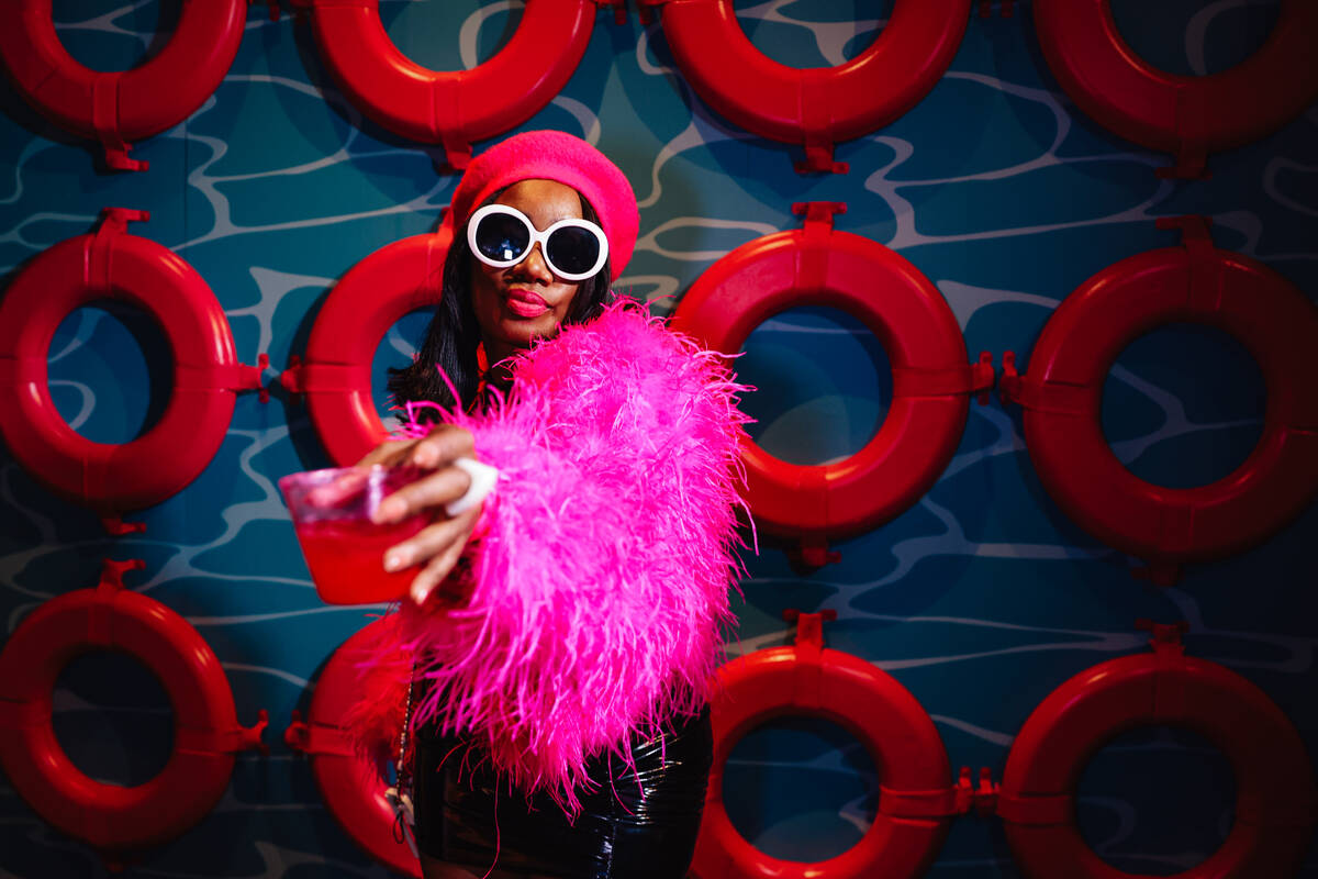 Briana Jackson toasts during the grand opening of the Malibu Barbie Cafe at Area15 Wednesday, D ...