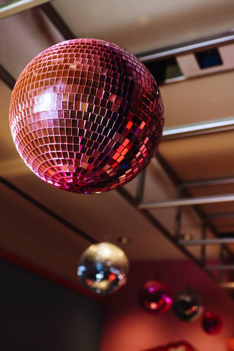 Disco balls shine during the grand opening of the Malibu Barbie Cafe at Area15 Wednesday, Dec. ...